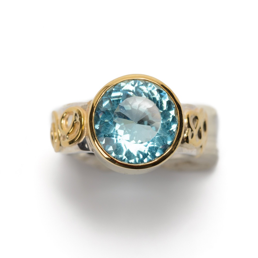 Handmade-Ring-XXL-blue-topaz-set-in-gold, ring-silver-with-gold-curls
